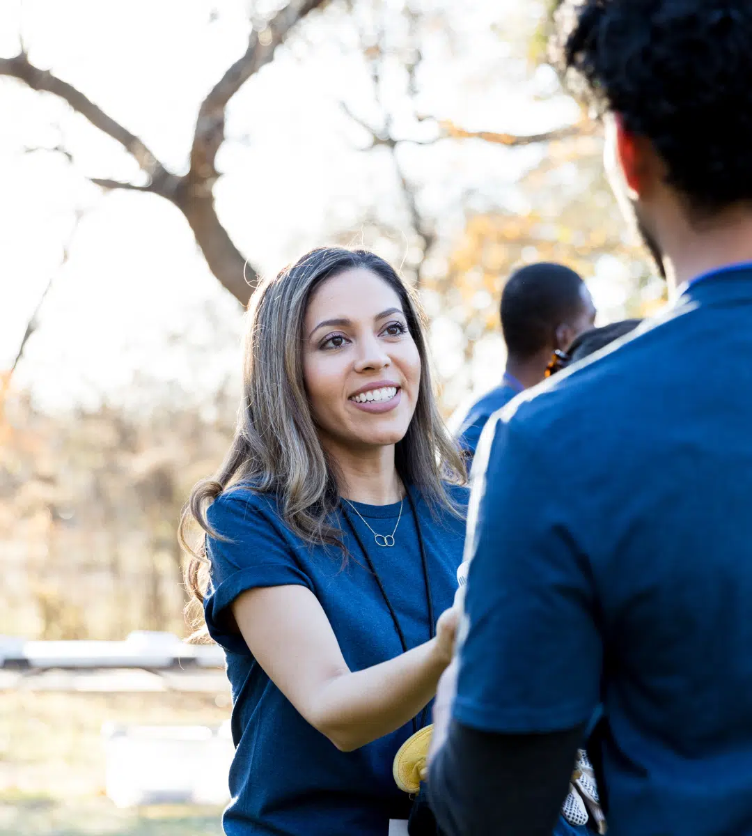 Woman volunteering outside during her service year