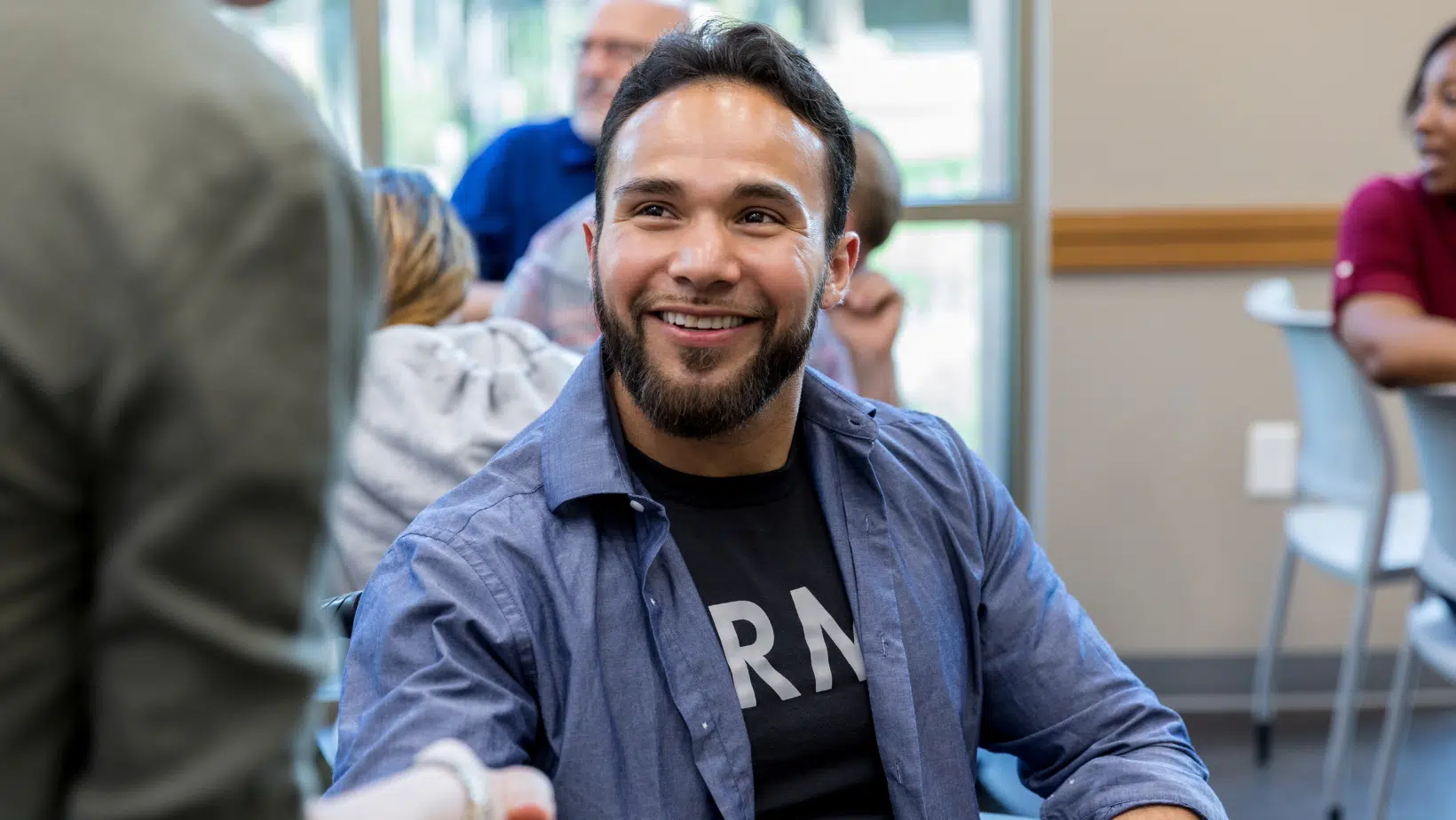 Army Veteran Smiling While in a Classroom