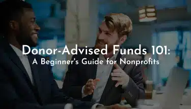 African American Man smiling with Caucasian Man inside an office building with the title, "Donor-Advised Funds 101"