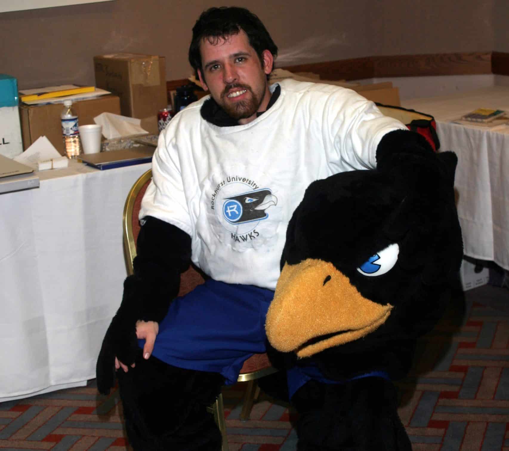 Rockhurst University mascot sitting on a chair