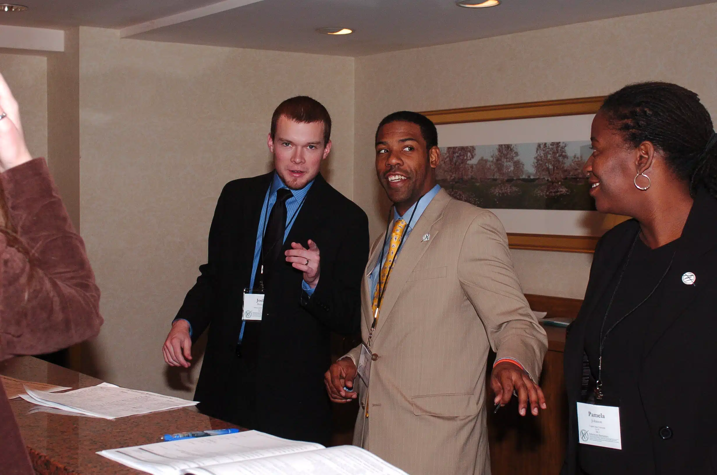 Two men speaking to eachother in full suits