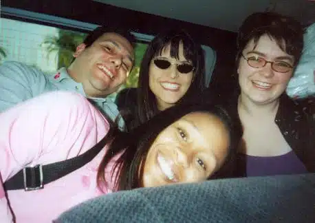 Four young college students sitting in a car together on the way to the nonprofit leadership alliance's conference