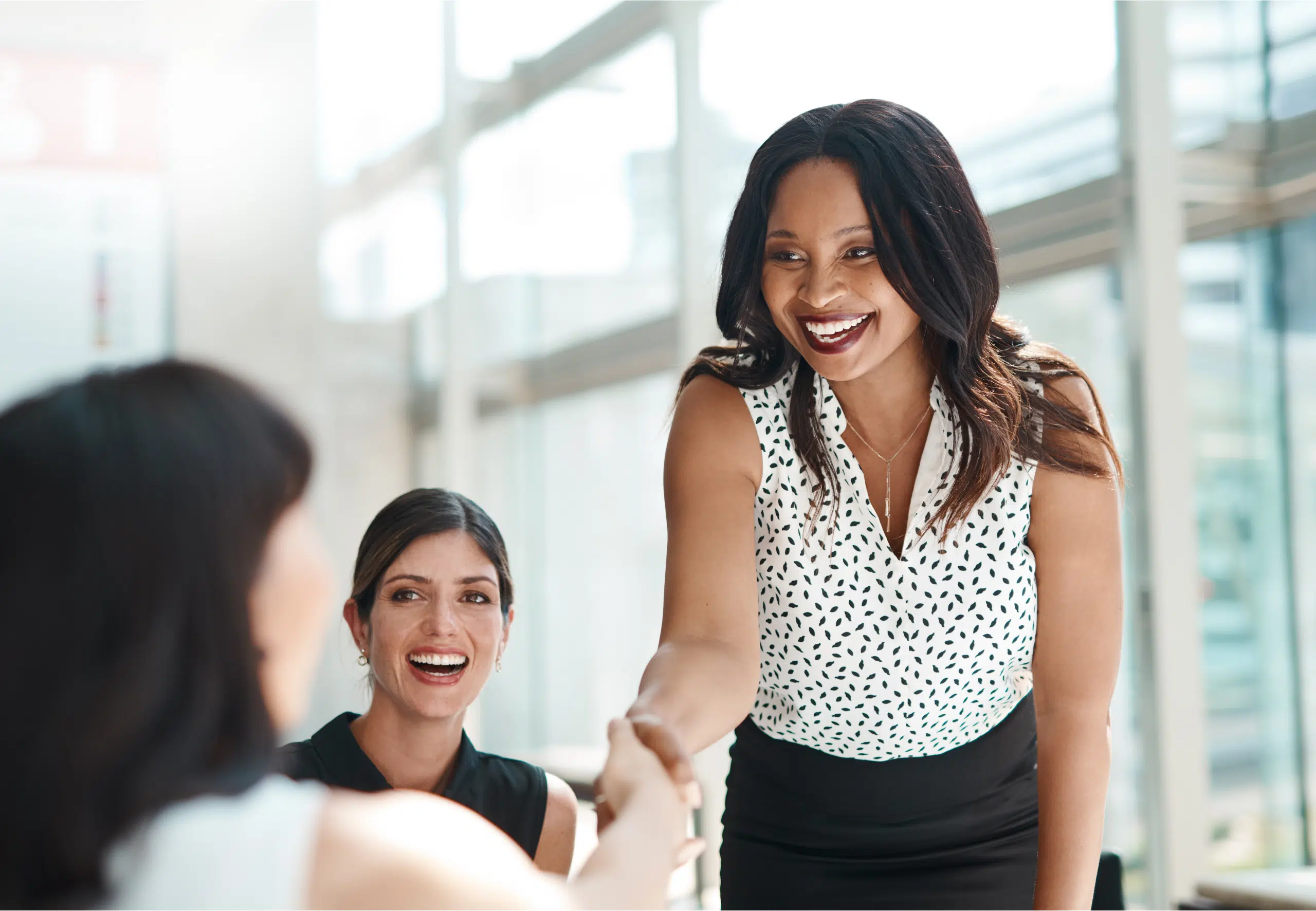 African American woman shaking hands with a colleague