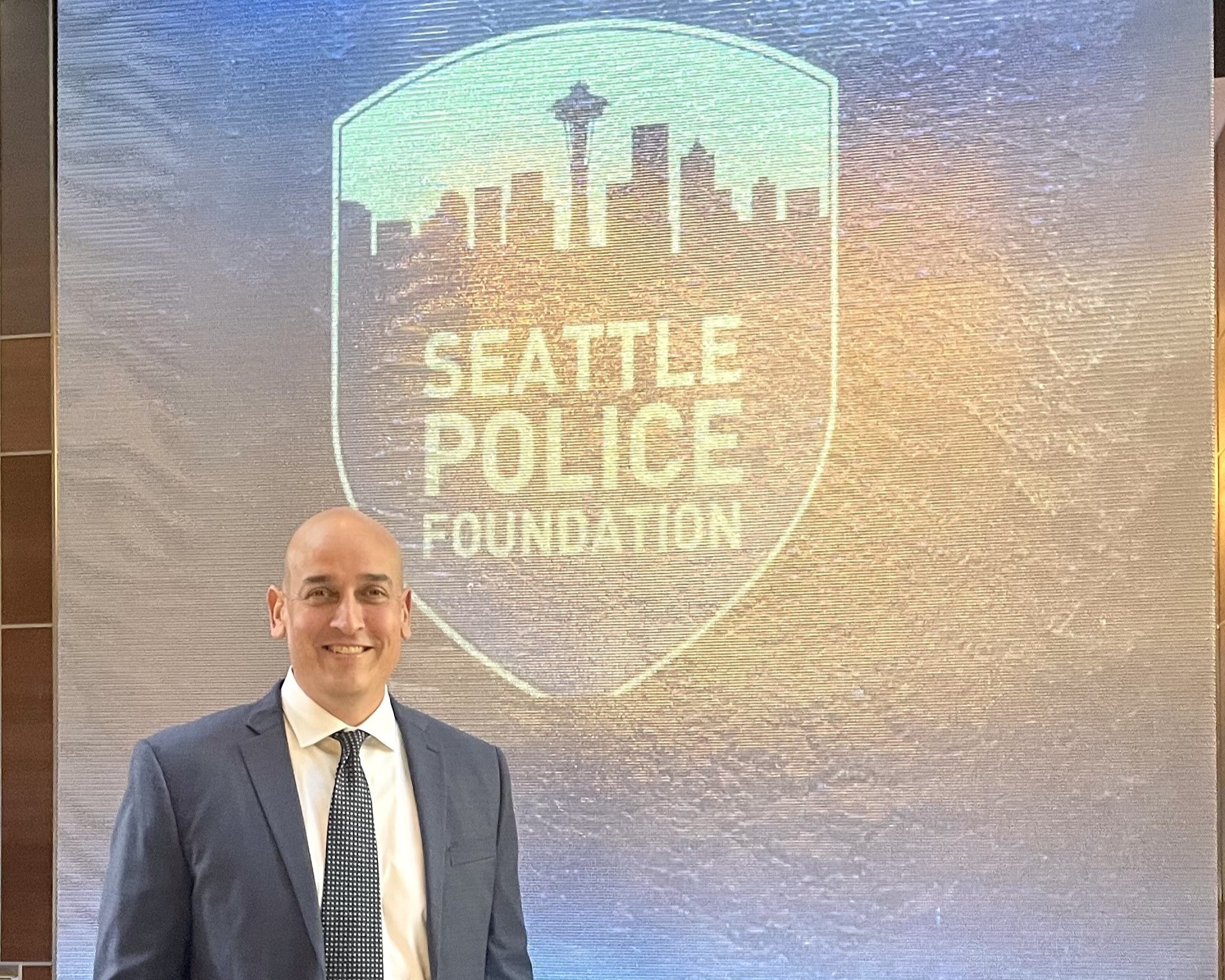 Advanced Certified Nonprofit Professional, Ian Adair smiling at a Seattle Police Foundation Event
